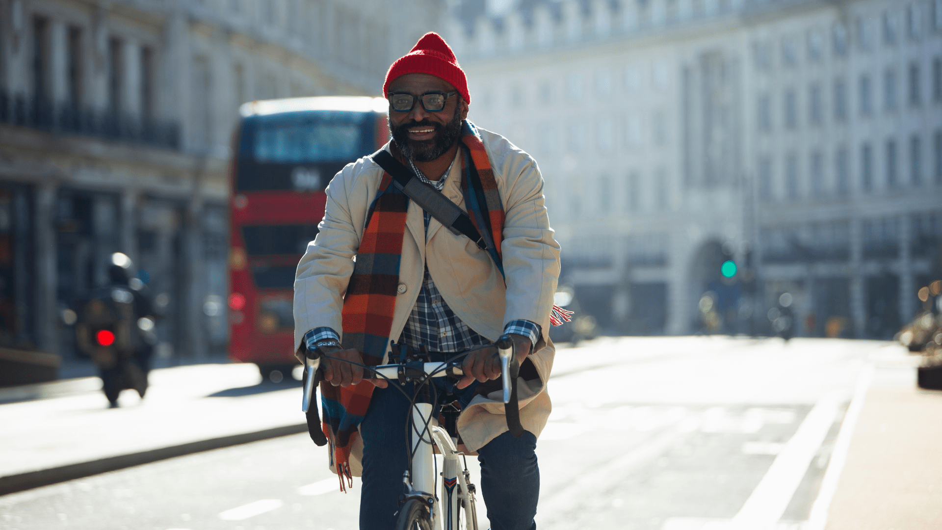 A man are riding bicycle on the street